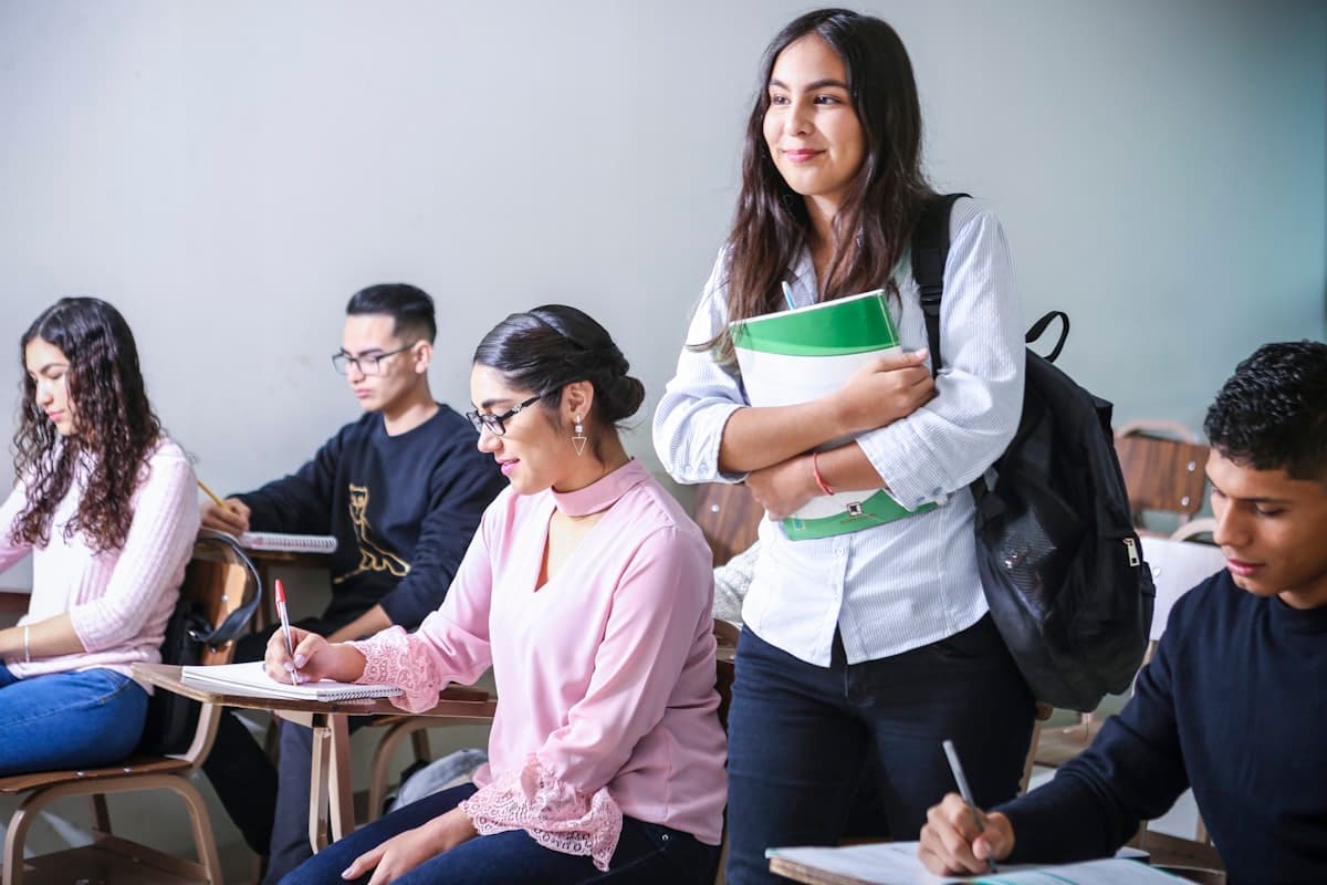 Adult students taking notes in a classroom